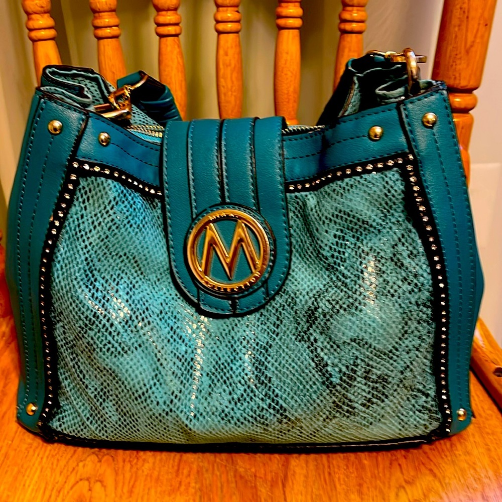 Turquoise purse, snakeskin accents with rhinestone trim.
